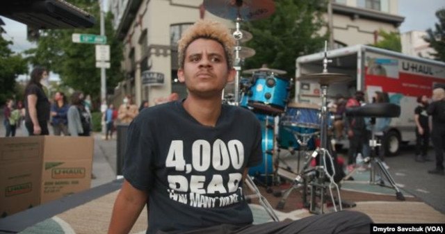  Джаст Маршалл, демонстрант і музикант